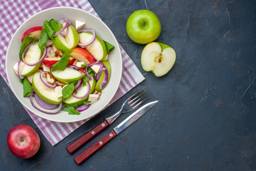 Apple salad prepared as a simple way to include apples in a balanced daily diet
